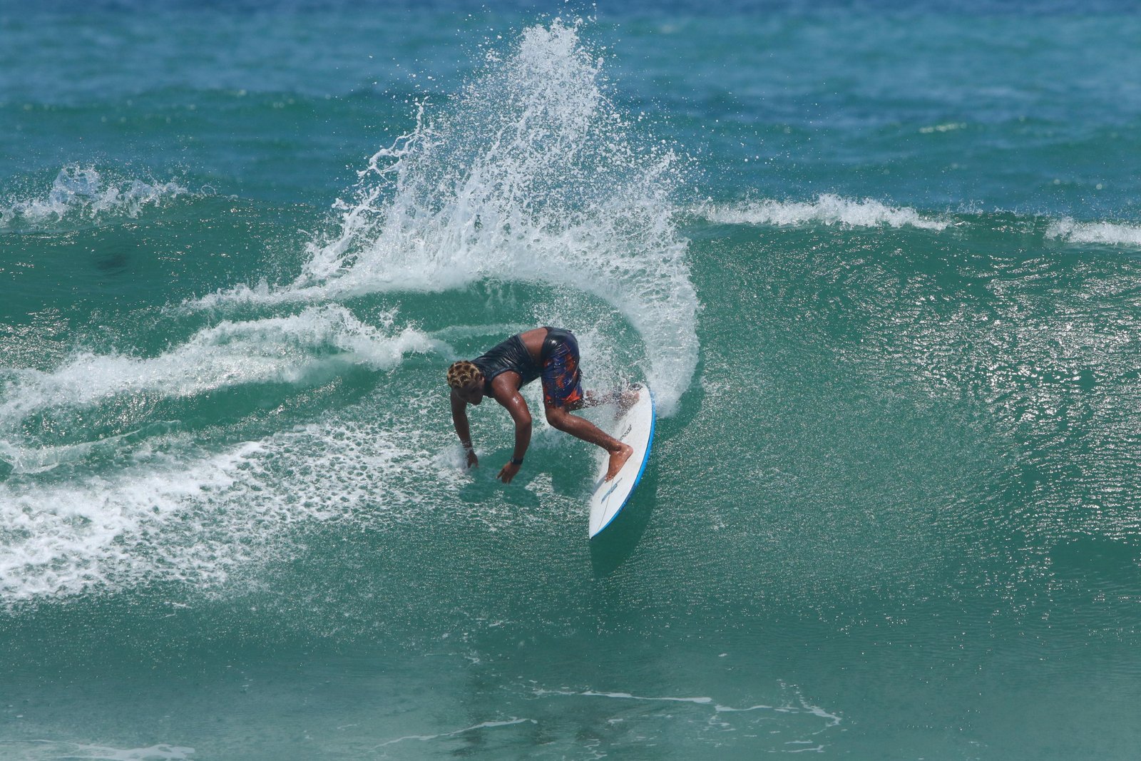 Surfer riding inside a barrel wave at Balangan
